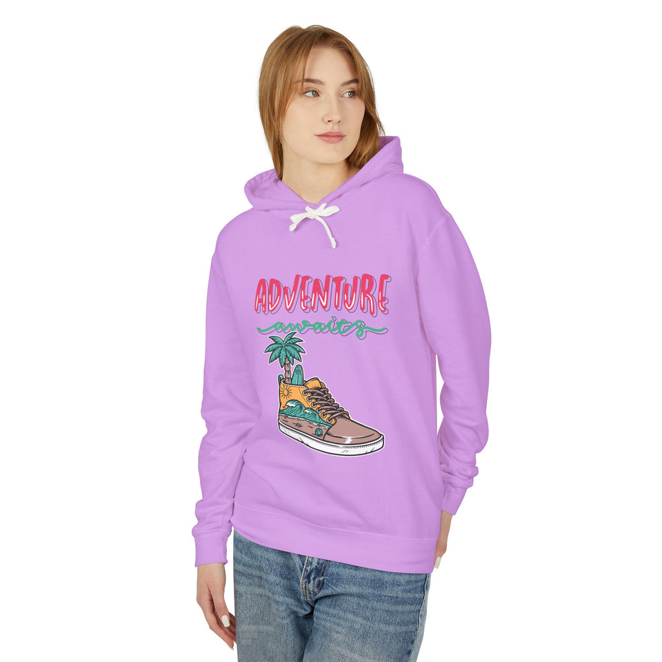 Teen wearing a trendy lilac streetwear hoodie with 'Adventure Awaits' sneaker graphic