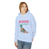 Teen girl modeling light blue hoodie with 'Adventure Awaits' graphic, trendy youth streetwear