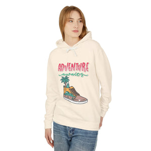 Teen wearing trendy cream hoodie with 'Adventure awaits' graphic and casual jeans, streetwear fashion
