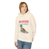 Teen wearing trendy cream hoodie with 'Adventure awaits' graphic and casual jeans, streetwear fashion