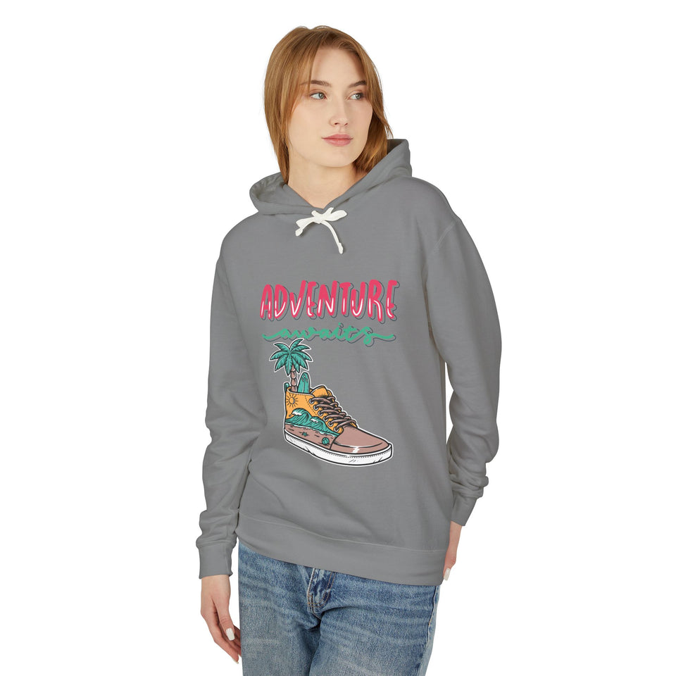 Teen wearing gray streetwear hoodie with 'Adventure Awaits' and sneaker graphic, casual youth fashion